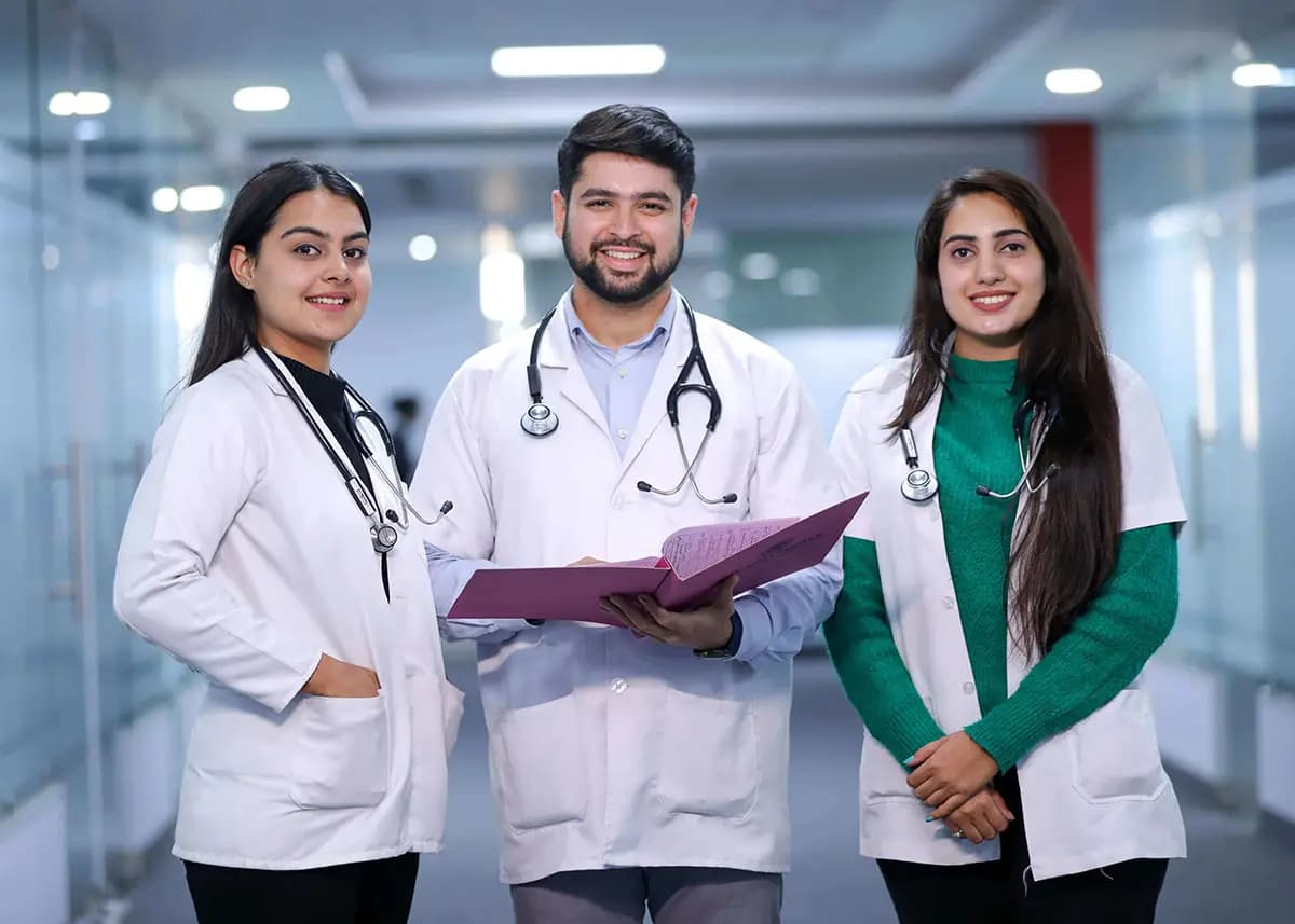 Medical student with stethoscope and books